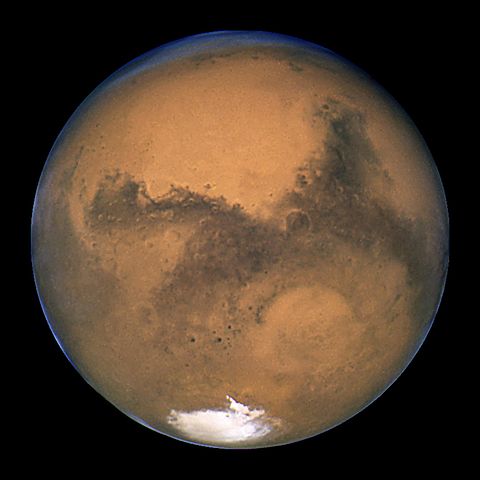 Mars-the-red-planet-appears-pinkish-red-covered-with-grayish-swaths-as-seen-by-Hubble-Telescope